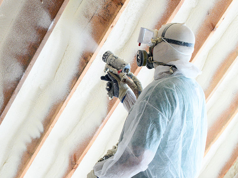 Standard technician blowing insulation